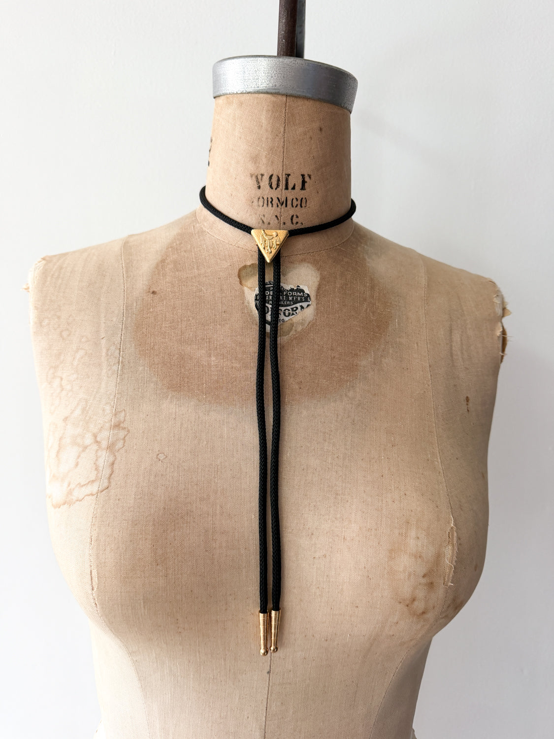 1970s Vintage Golden Saddle Triangle Bolo Tie