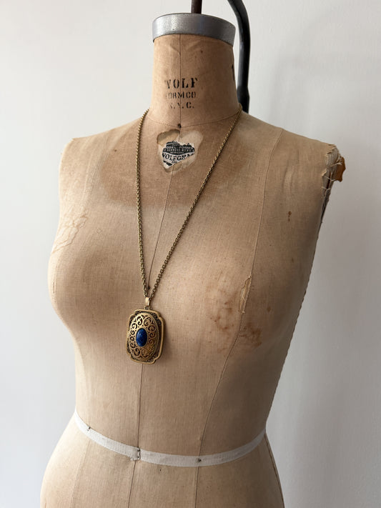 1980s Vintage Gold Swirling Blue Cabochon "Yesteryear Future Locket" by Avon