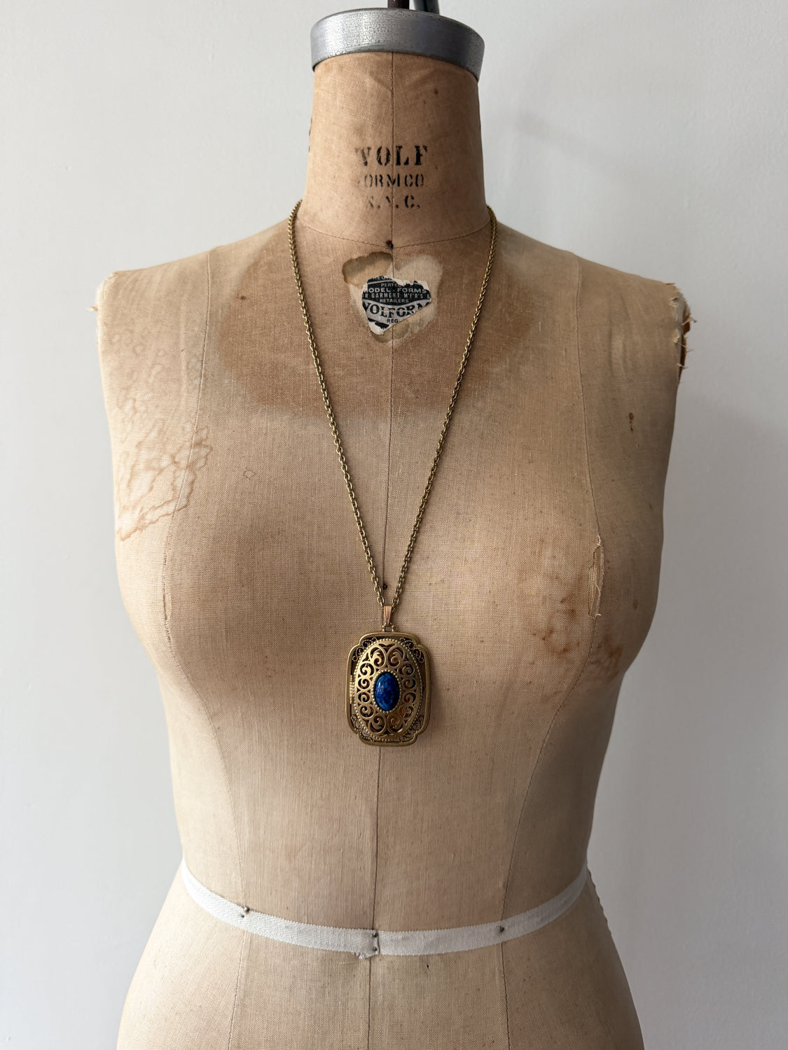 1980s Vintage Gold Swirling Blue Cabochon "Yesteryear Future Locket" by Avon