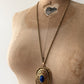 1980s Vintage Gold Swirling Blue Cabochon "Yesteryear Future Locket" by Avon