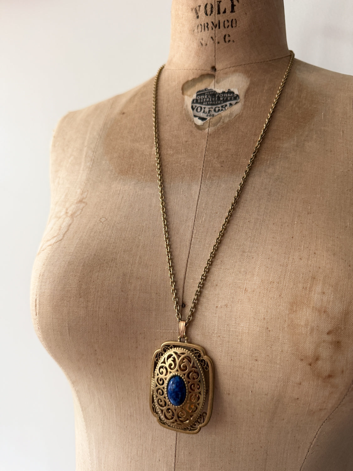 1980s Vintage Gold Swirling Blue Cabochon "Yesteryear Future Locket" by Avon
