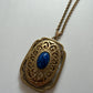 1980s Vintage Gold Swirling Blue Cabochon "Yesteryear Future Locket" by Avon