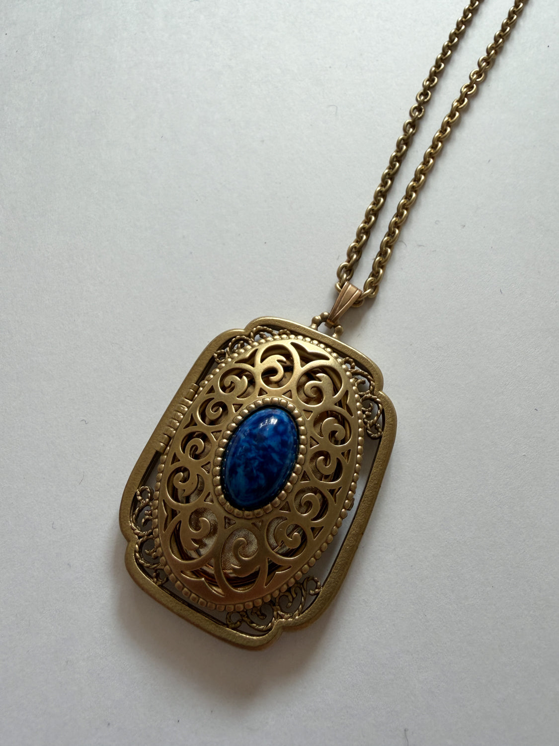 1980s Vintage Gold Swirling Blue Cabochon "Yesteryear Future Locket" by Avon