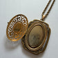 1980s Vintage Gold Swirling Blue Cabochon "Yesteryear Future Locket" by Avon