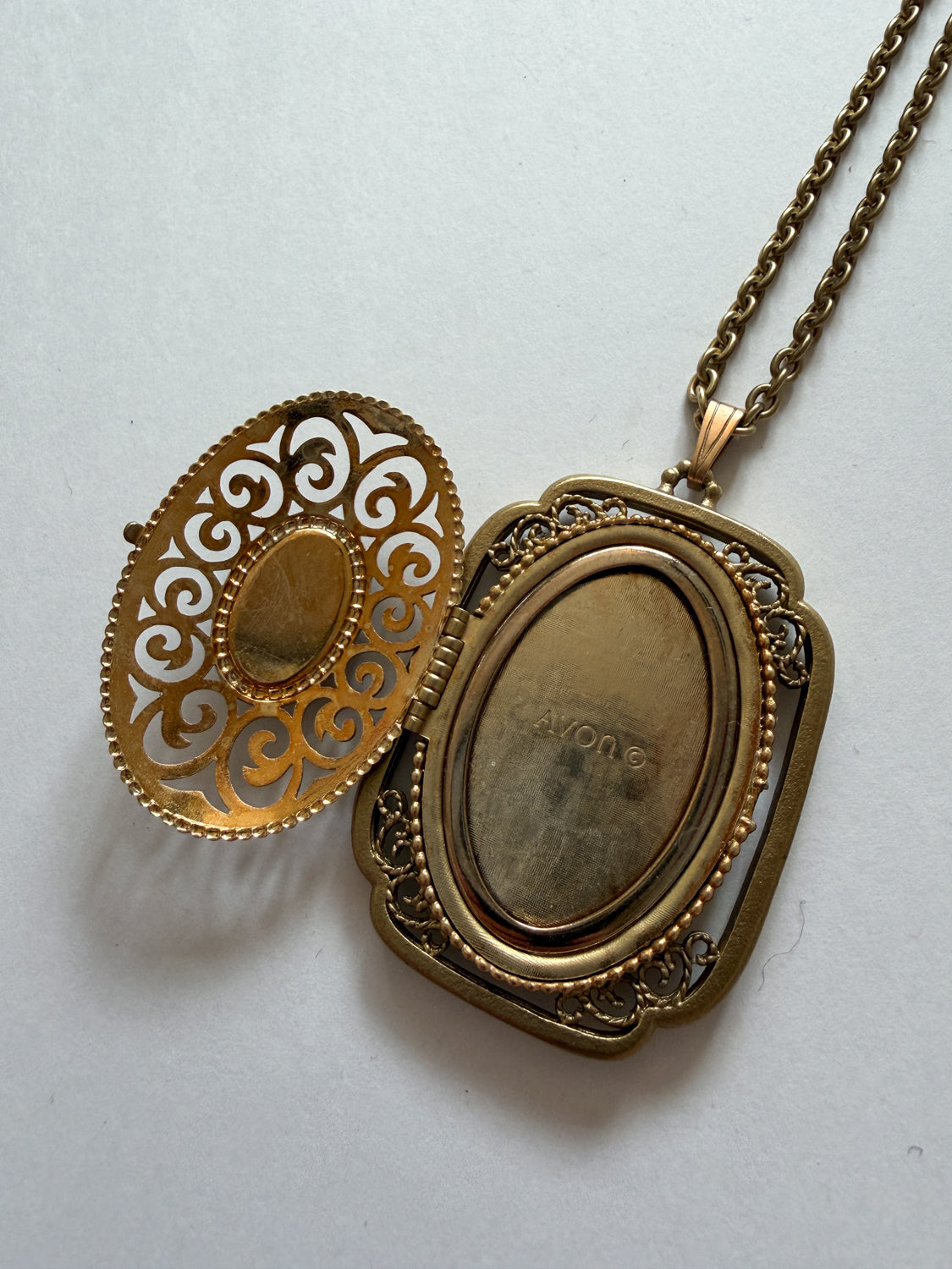 1980s Vintage Gold Swirling Blue Cabochon "Yesteryear Future Locket" by Avon